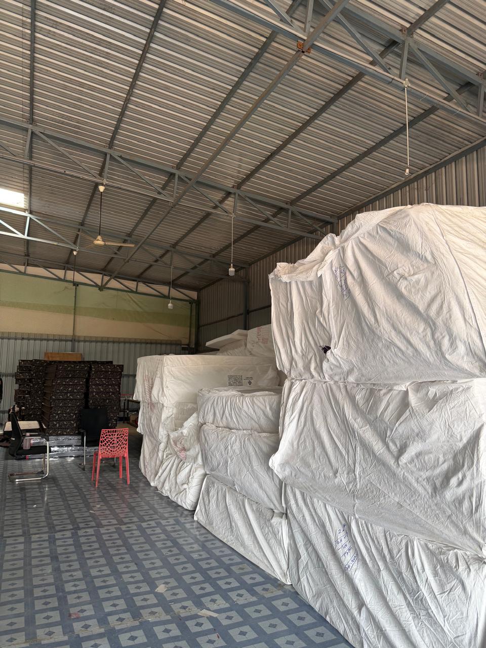 Baled raw material stacked in the Virtue Foam Industries warehouse