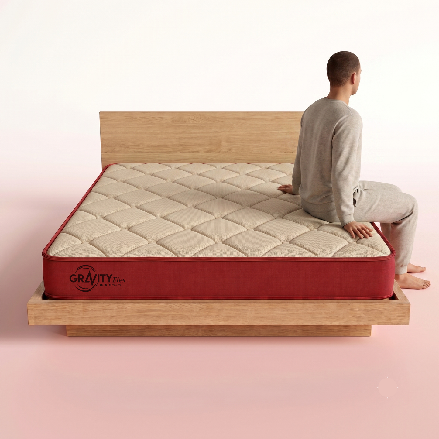 Person seated on the edge of a Gravity Flex Budge 5 inch mattress