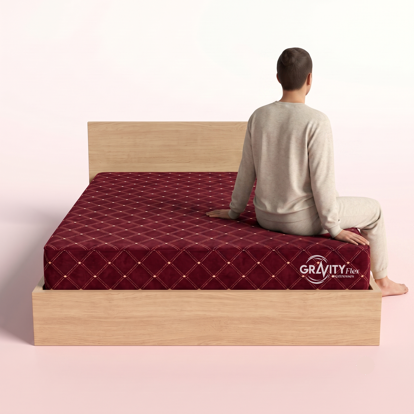 Person seated on the edge of a Gravity Flex Ortho 6 inch mattress