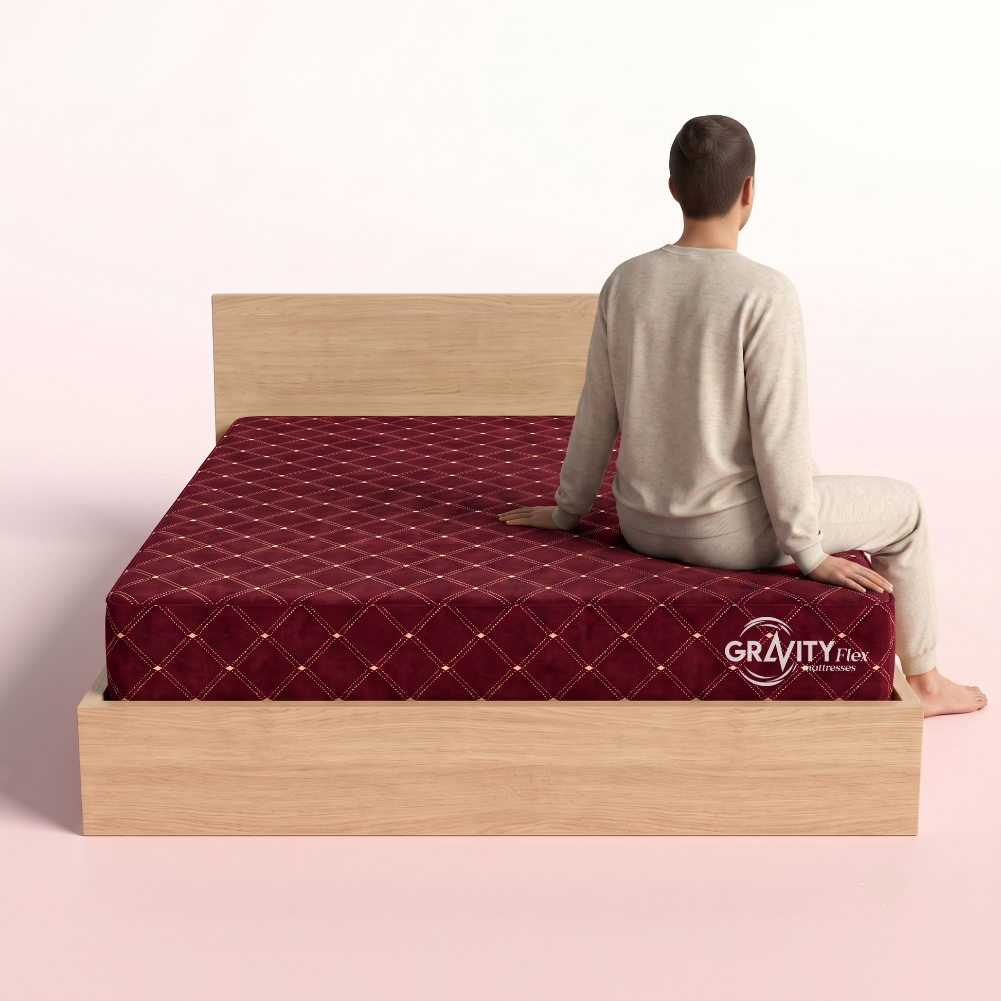 Person seated on the edge of a Gravity Flex Ortho 6 inch mattress